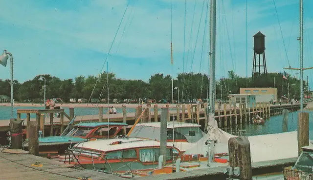 NE East Tawas MI 1960-х VACATION SWIN FUN Village Tachts Fishing and Pleasure Boats at Harbor Marina Pier looking to Beach Travel TRainer Ca